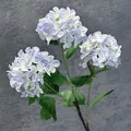 Artificial snowball hydrangea with three light purple and white flower heads and green leaves - Light Blue