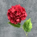 Vibrant red faux hydrangea stem with realistic green leaves and large fabric flower head - Red