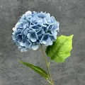 Single stem artificial hydrangea in dark blue with gradient petals and green leaves - Haze Blue
