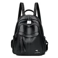 Classic black leather backpack featuring stylish tassel charms and kangaroo logo detail - Black