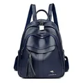Dark blue leather backpack for women featuring fringe tassels and a metal kangaroo logo - Blue