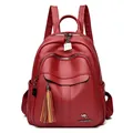 Deep red faux leather backpack for women featuring lychee texture and tassel charm - Red