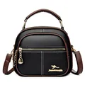 Classic black litchi pattern leather round bag with brown trim and golden kangaroo logo - Black