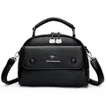 Classic black leather doctor bag with metal kangaroo logo and detachable shoulder strap - Black