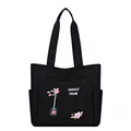 Large black canvas tote bag with pink flower embroidery and practical side pockets - Black