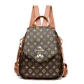 Brown monogram printed backpack with golden kangaroo lock and convertible straps - Patterned Brown