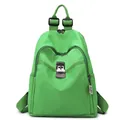 Bright green nylon backpack featuring brown leather straps and metal buckles in front - Light Green