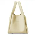 Minimalist beige lychee grain leather bucket tote bag with top handles by HOGOMU - Yellow