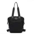 Minimalist black waterproof nylon backpack for men and women with circular logo - Black