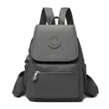 Minimalist dark grey nylon backpack featuring a brand logo and functional zippers - Dark Gray