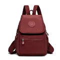 Mochila de tela lavada impermeable en rojo burdeos con múltiples bolsillos de cremallera - Rojo
