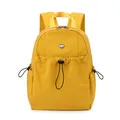 Water-resistant yellow nylon backpack with drawstring front pocket and adjustable side cords - Yellow