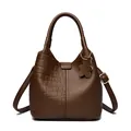 Dark brown leather bucket bag featuring crocodile and lychee texture with bear charm - Brown Crocodile Pattern