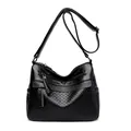 Classic black quilted messenger bag with pebble grain texture and adjustable shoulder strap - Black
