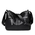 Classic black leather crossbody bag with multiple zip pockets and textured finish - Black