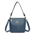 Dark blue leather bucket bag featuring elegant rose embossing and gold hardware - Blue