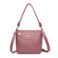 Pink leather bucket bag with embossed rose pattern and golden kangaroo logo detail - Purple