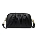 Black pebbled leather crossbody bag with pleated detail and golden metal hardware - Black