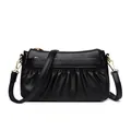 Elegant black leather crossbody bag with stylish pleated design and gold metal accents - Black