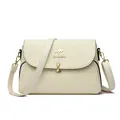 Cream leather crossbody bag featuring elegant crocodile texture and golden clasp detail - Off White