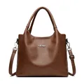 Vintage brown leather tote bag with silver Yifulin metal logo and adjustable shoulder strap - Yellow