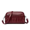 Burgundy ruched leather crossbody bag with silver zippers and lychee texture finish - Red