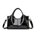Glossy black patent leather handbag for women with gold hardware and shoulder strap - Black