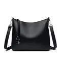 Classic black leather bucket bag with litchi texture and silver tassel accents - Black