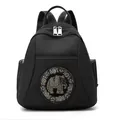Water-resistant black nylon backpack featuring a sparkling elephant motif and silver zippers - Black