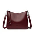 Deep burgundy leather bucket bag with litchi texture and silver hardware details - Red