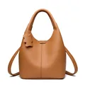 Minimalist brown pebbled leather bucket handbag with a matching bear charm accessory - Yellow