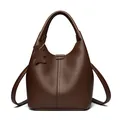 Dark brown lychee pattern leather bucket bag with top handles and a cute bear tag - Brown
