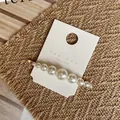 Detail of Korean style handmade pearl hair clip with gold metal base on display card - Gradient Size Pearl Style (Style A) / Style A