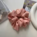 Elegant satin silk scrunchie in soft pink color for French style hair styling - Peach Pink