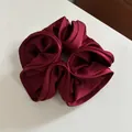 Elegant oversized burgundy satin scrunchie with a glossy finish and pleated texture - Burgundy