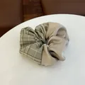 Detail of plaid fabric and champagne satin patchwork on this vintage hair scrunchie - Green Color-blocked Hair Tie