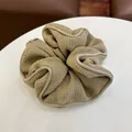 Detailed view of the textured khaki fabric and smooth piping on the oversized scrunchie - Coffee Solid Hair Ring