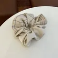 Plaid and satin拼接 hair scrunchie with cream beige checkered fabric and pearl luster finish - Beige - Patchwork Hair Tie