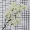 Single branch of white artificial cherry blossoms with dense silk petals and green stems - White