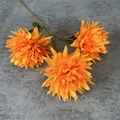 Vibrant orange artificial chrysanthemums with three blooming heads on grey background - Multi Head Single Stem / Orange
