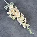 Artificial cream white delphinium stem with lifelike petals and green buds for home decor - Champagne