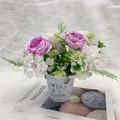 Artificial purple peonies in vintage metal garden bucket on white fur rug decor - Purple