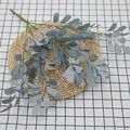 Artificial peanut leaves branch in dusty blue with white berries on a woven mat - Dusty Blue