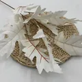 Artificial white oak leaf branch with realistic veins on a natural woven mat - Cream