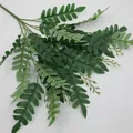 Artificial Boston fern branch with multi-forked green leaves and detailed plastic stems - Green