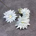 Light blue faux dahlia with three realistic flower heads and green leaves on stems - Light Blue