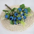 Artificial blue mini rose tea bouquet with silk petals and green foliage on beige mat - Blue