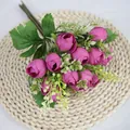 Artificial deep purple tea rose bud bouquet with green leaves on woven mat - Purplish Red