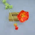 Detailed view of artificial orange poppy flower with flocked stem and realistic petals - Sunset Red