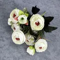 European style white artificial tea plums with dark leaves on a grey checkered cloth - White